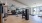Fitness center with treadmills, strength machines, and large windows.