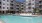 a building with a pool in front