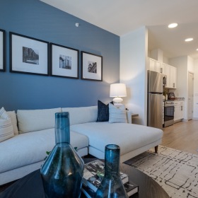Settle into comfort at Madison Ironbridge a room with a couch and a table