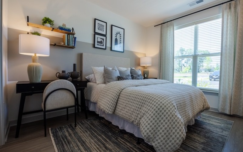 Bright, modern bedroom inside Madison Ironbridge one-bedroom apartments in Chester Virginia.